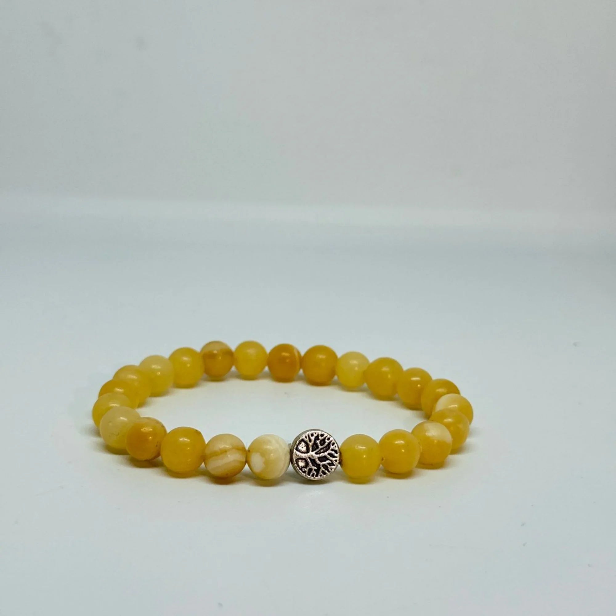 Yellow Calcite bracelet for personal empowerment, solar plexus chakra balance, confidence, mental clarity, stamina, vitality, digestion support, and inner strength with Star Codes.